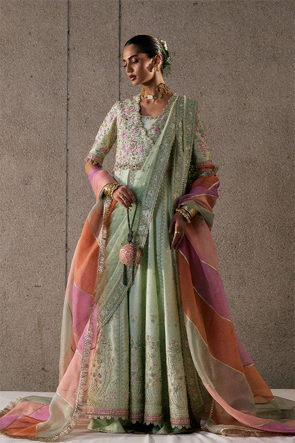 Model wearing pastel green embellished ensemble from Suffuse Aymara, Pakistani luxury pret, shop Pakistani clothes online in UK