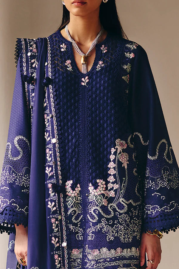 Model wearing deep navy blue embroidered dress with intricate detailing from Suffuse Casual Pret 2025 Sahra. Pakistani luxury pret in UK.
