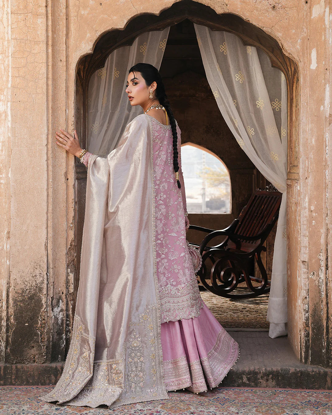 Model wearing blush pink Faiza Saqlain Vemita outfit with embellished detailing and dupatta, perfect for Pakistani luxury pret in the UK.