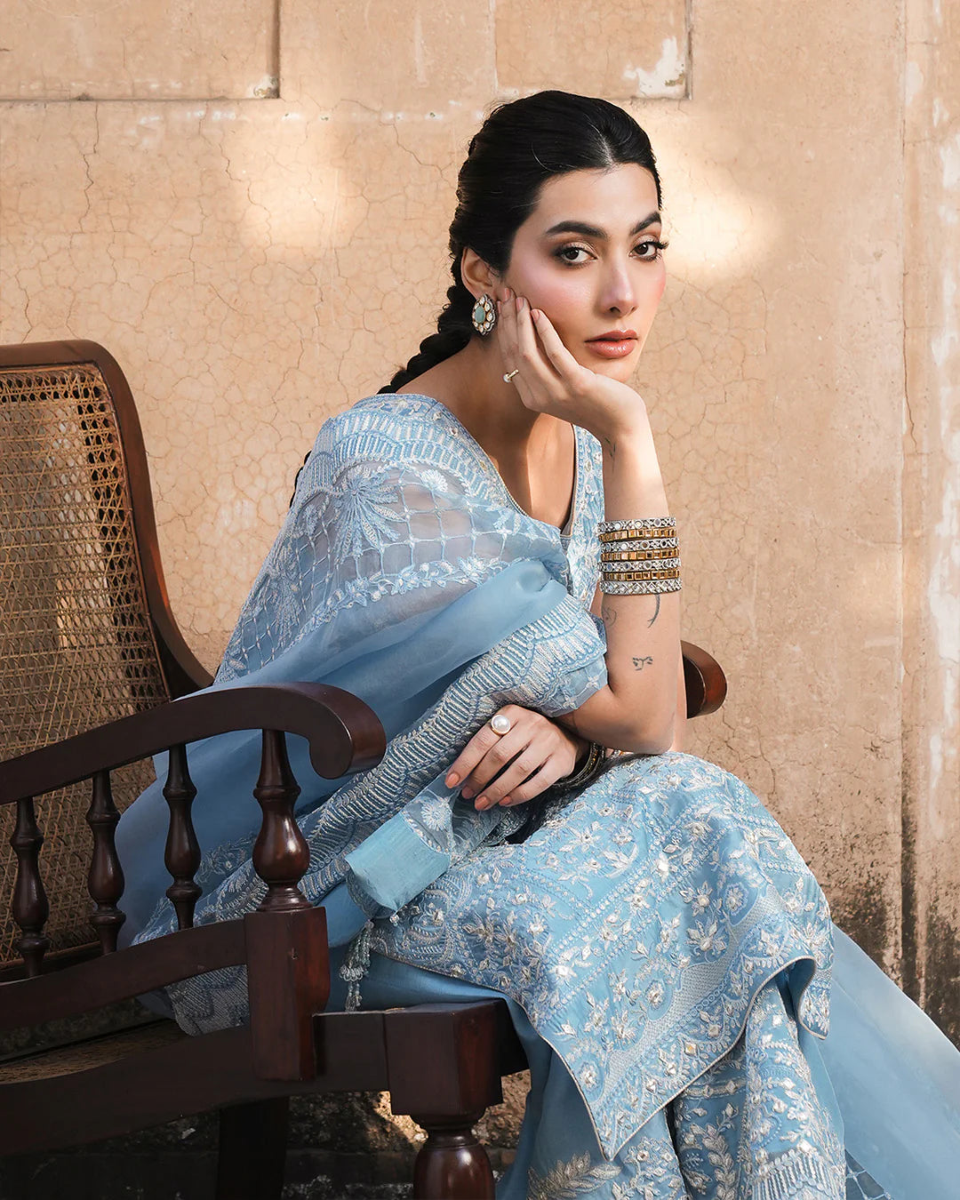 Model wearing powder blue Faiza Saqlain Yulia outfit with intricate embroidery and scalloped dupatta, ideal for Pakistani luxury pret in UK.