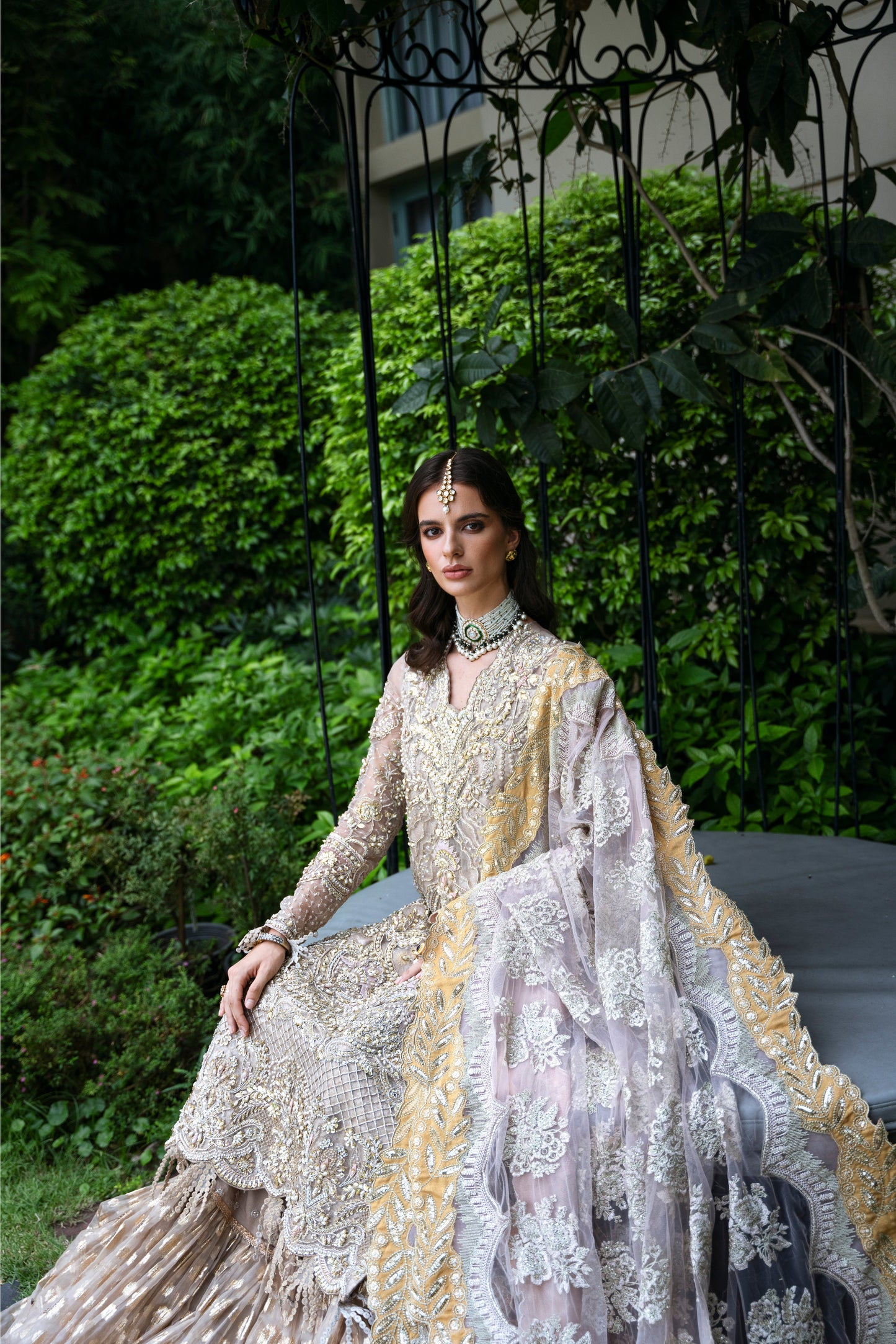 Model wearing PEONY from Mysie by Tahira, a soft beige and gold embellished ensemble, perfect for Pakistani luxury pret in the UK.
