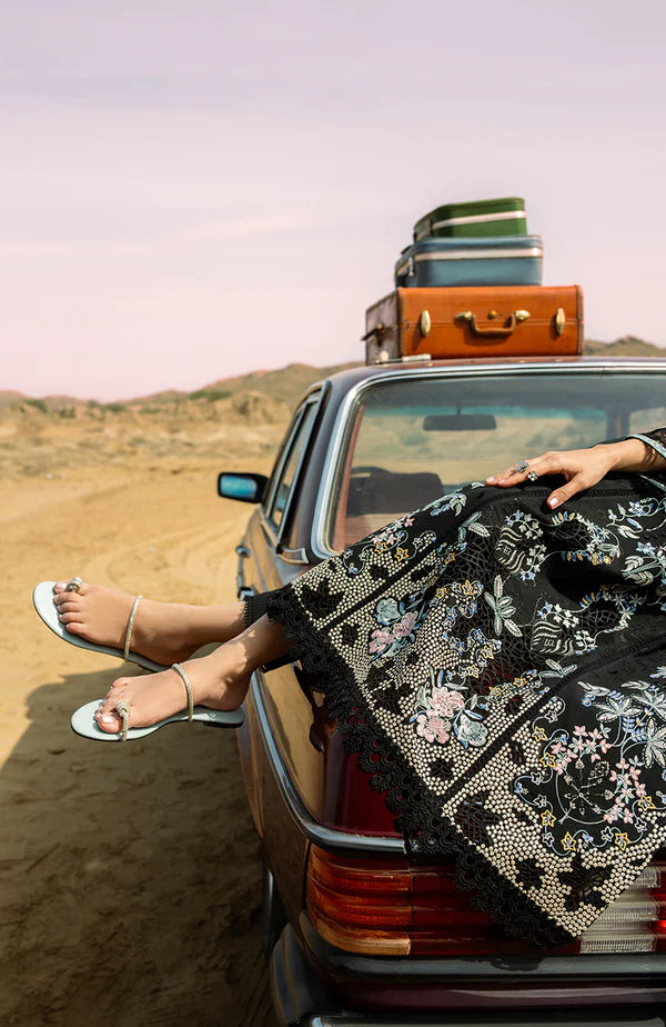 Model wearing black embroidered dress with detailed sleeves and dupatta from Soraya Noa Summer Casual Pret 2025 Mavro. Pakistani clothes online UK.