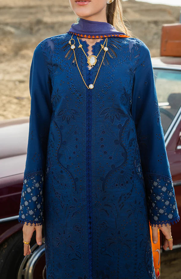 Model wearing royal blue embroidered dress with floral dupatta from Soraya Noa Summer Casual Pret 2025 Azul. Pakistani luxury pret in UK.