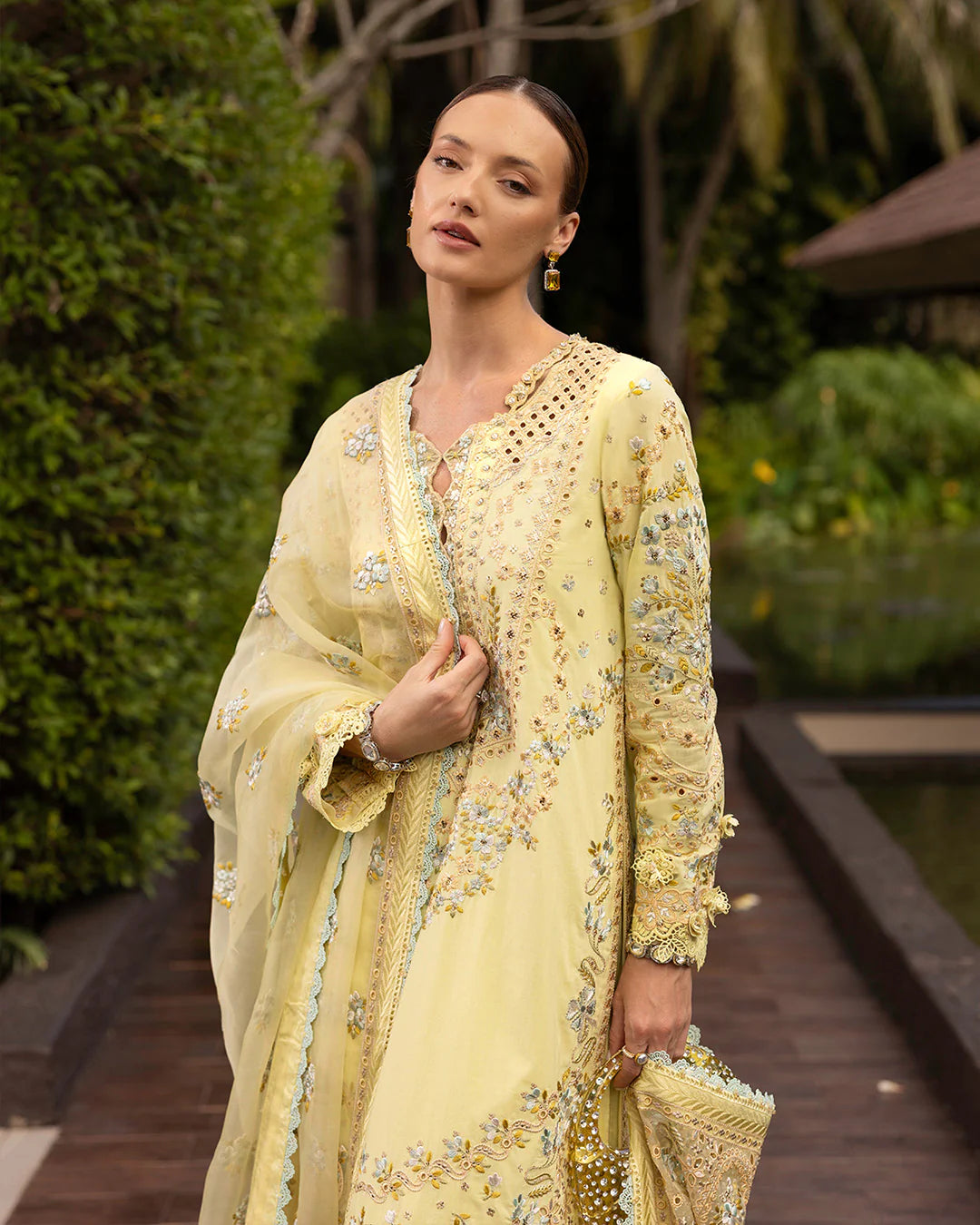Model wearing pastel yellow Azalea dress from Faiza Saqlain Zinnia collection, Pakistani Luxury pret, Faiza Saqlain Pakistani clothes online in UK.