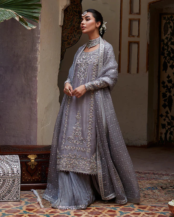 model wearing grey embroidered dress by Faiza Saqlain, Pakistani luxury pret available online in UK