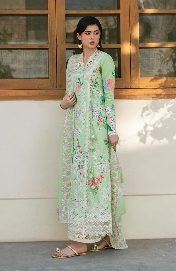 Model wearing mint green embroidered dress with floral detailing and lace hem from Soraya Noa Summer Casual Pret 2025 Willow. Pakistani clothes online UK.