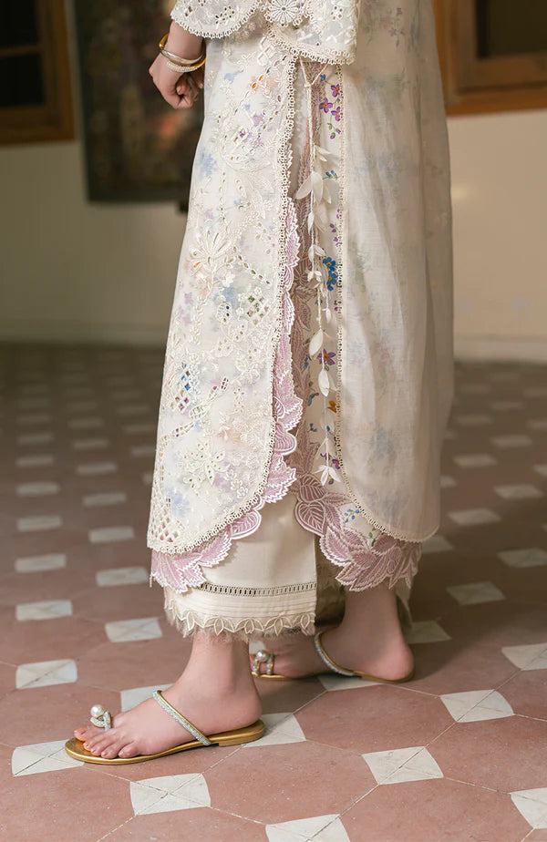 Model wearing off-white floral embroidered dress with lace sleeves and pastel accents from Soraya Noa Summer Casual Pret 2025 Bianca. Pakistani clothes online UK.