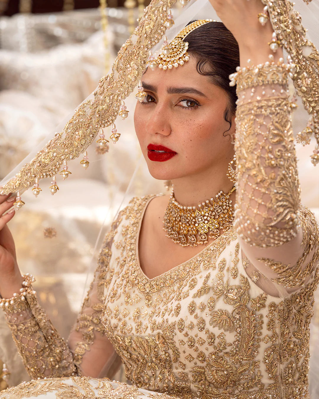 Model wearing cream and gold bridal dress Gelin by Faiza Saqlain, Pakistani luxury pret online in UK for wedding events.