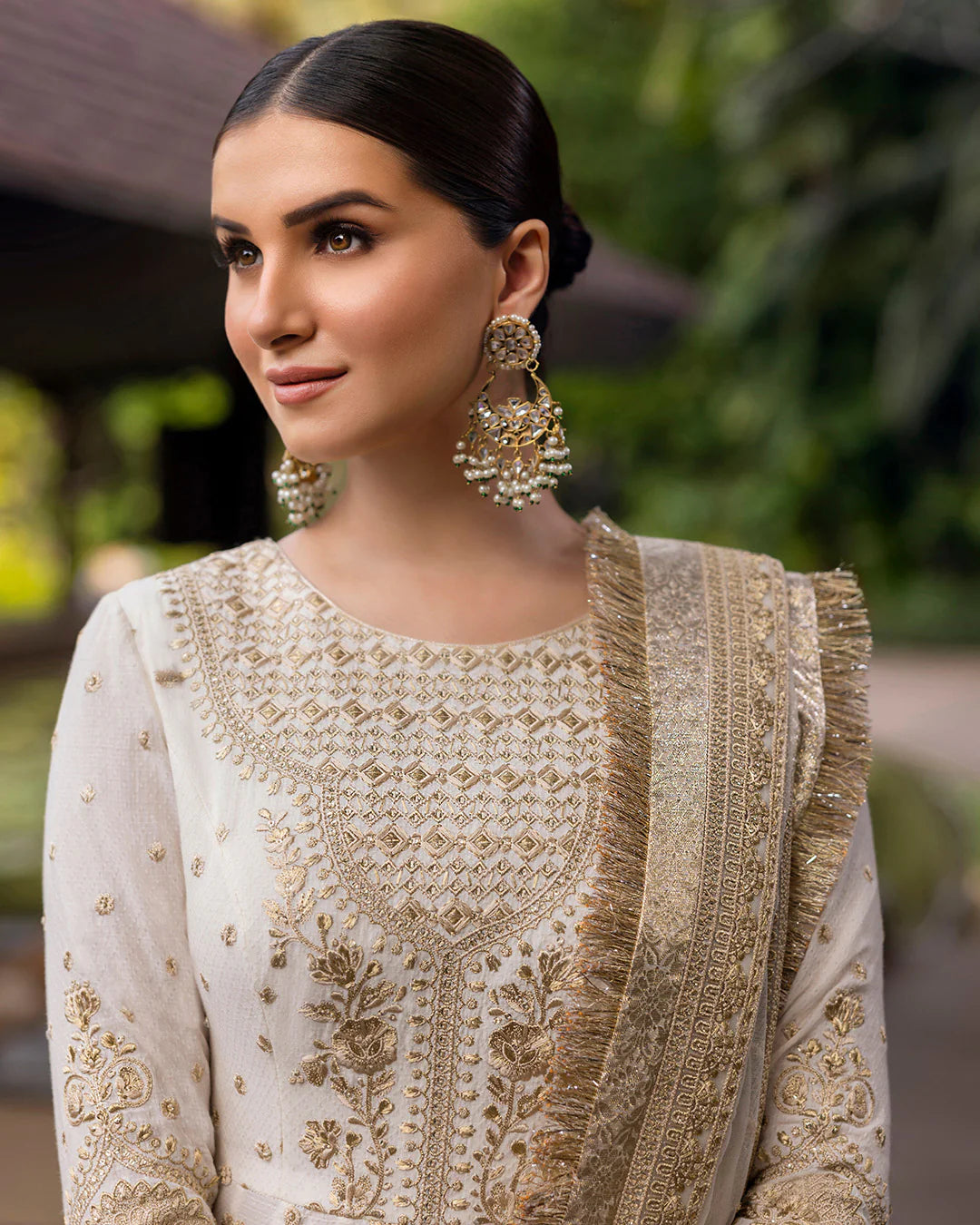 Model wearing ivory gold Lily dress from Faiza Saqlain Zinnia collection, Pakistani Luxury pret, Faiza Saqlain Pakistani clothes online in UK.