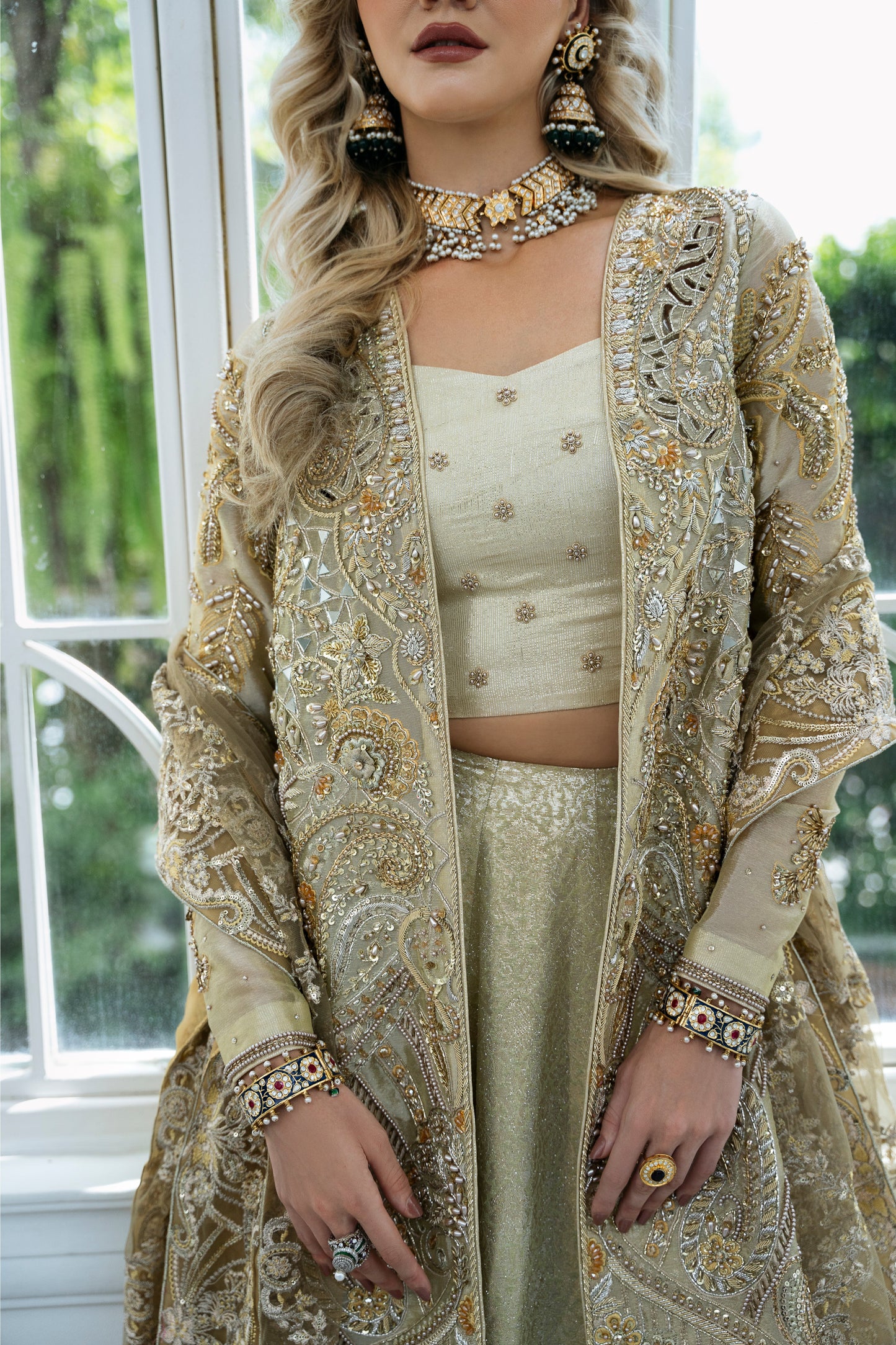 Model wearing Marigold from Mysie by Tahira, a golden-hued ensemble with intricate embroidery, ideal for Pakistani luxury pret in the UK.