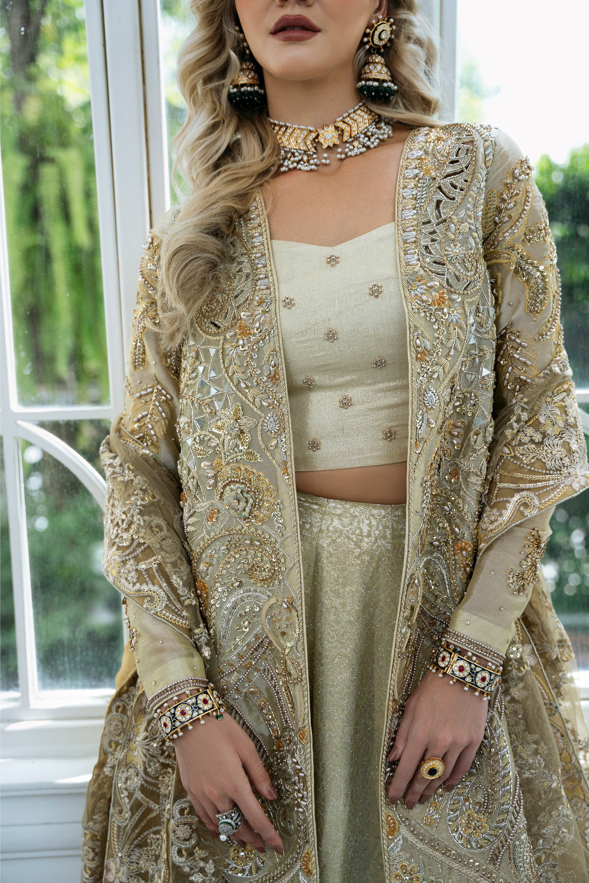 Model wearing Marigold from Mysie by Tahira, a golden-hued ensemble with intricate embroidery, ideal for Pakistani luxury pret in the UK.
