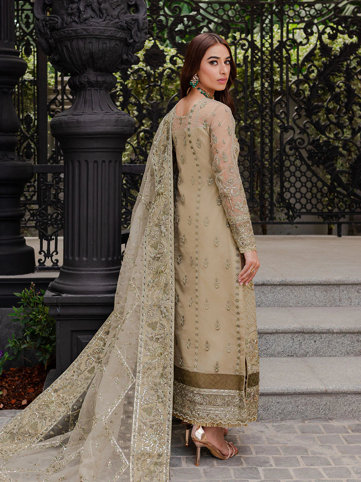 Model wearing beige Warina GL-LP-V1-05 from Gulaal, a heavily embellished Pakistani luxury pret—shop Gulaal clothes online in UK.