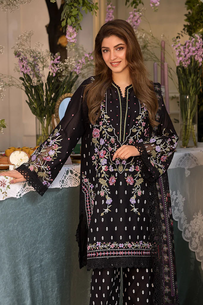 Model wearing Sobia Nazir Vital 2025 Design 5A in black with multicolour floral embroidery. Shop Pakistani luxury pret online in UK.