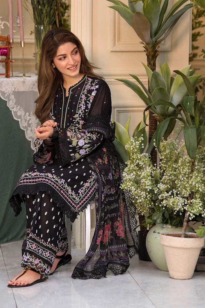 Model wearing Sobia Nazir Vital 2025 Design 5A in black with multicolour floral embroidery. Shop Pakistani luxury pret online in UK.
