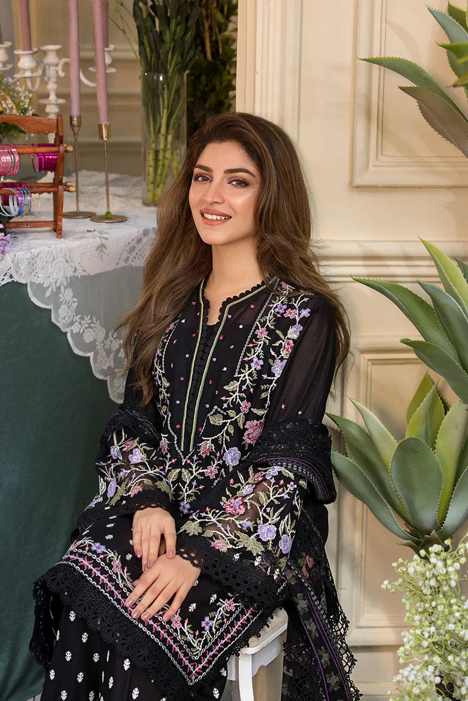 Model wearing Sobia Nazir Vital 2025 Design 5A in black with multicolour floral embroidery. Shop Pakistani luxury pret online in UK.