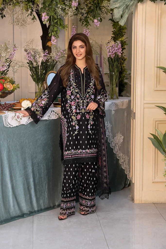 Model wearing Sobia Nazir Vital 2025 Design 5A in black with multicolour floral embroidery. Shop Pakistani luxury pret online in UK.