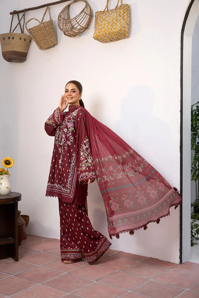 Model wearing deep maroon embroidered dress from Sobia Nazir Vital 2025 Design 5B. Pakistani luxury pret and Pakistani clothes online in UK.