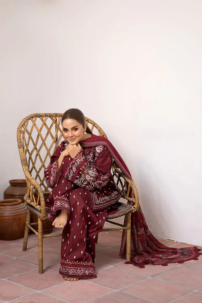 Model wearing deep maroon embroidered dress from Sobia Nazir Vital 2025 Design 5B. Pakistani luxury pret and Pakistani clothes online in UK.