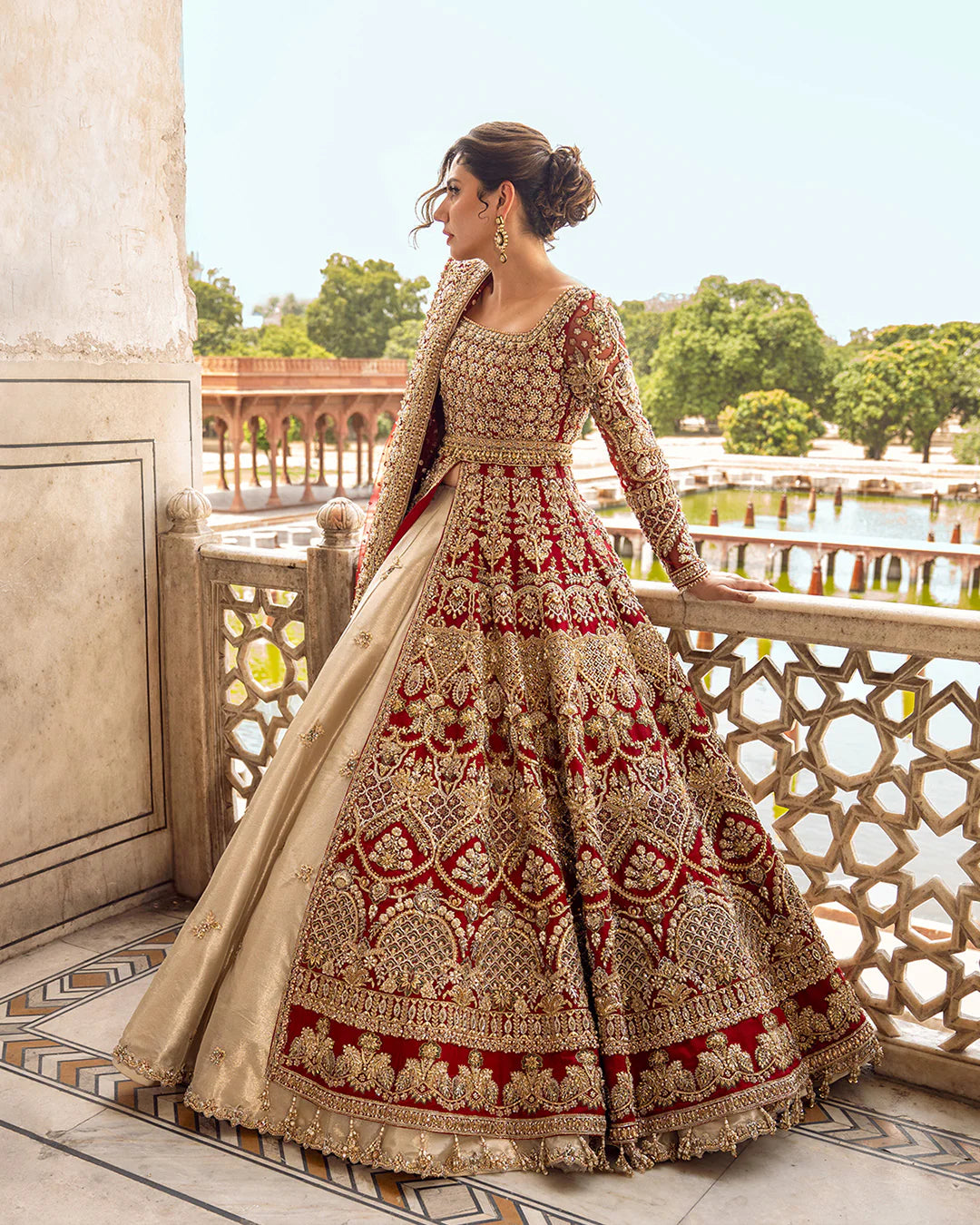Model wearing deep red and gold bridal dress Juri by Faiza Saqlain, Pakistani luxury pret online in UK for weddings.