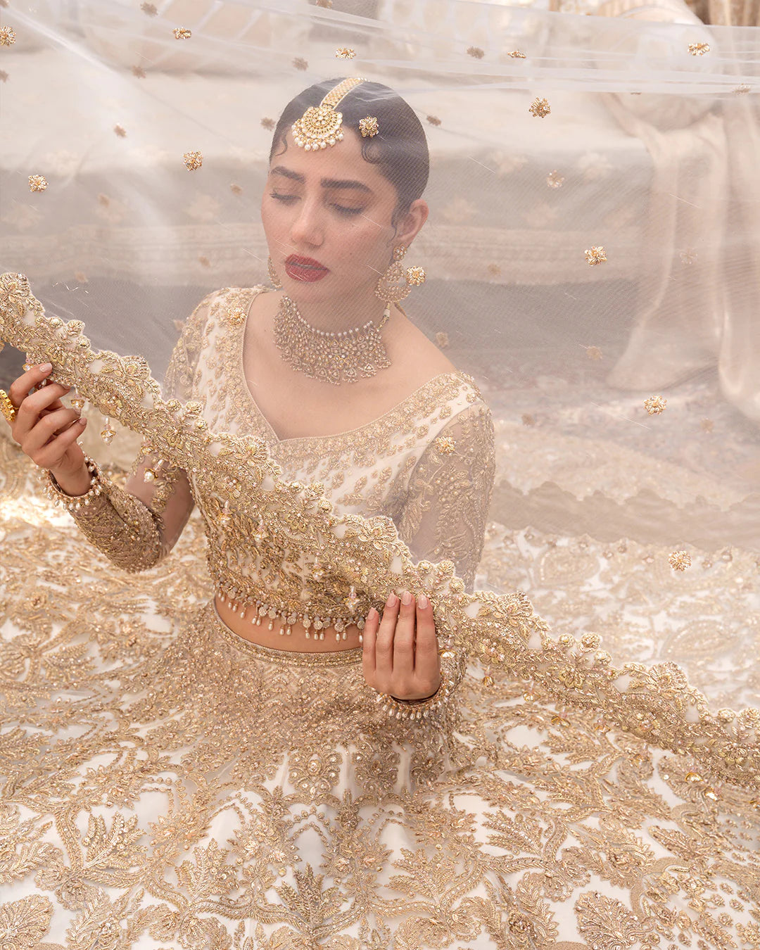 Model wearing cream and gold bridal dress Gelin by Faiza Saqlain, Pakistani luxury pret online in UK for wedding events.
