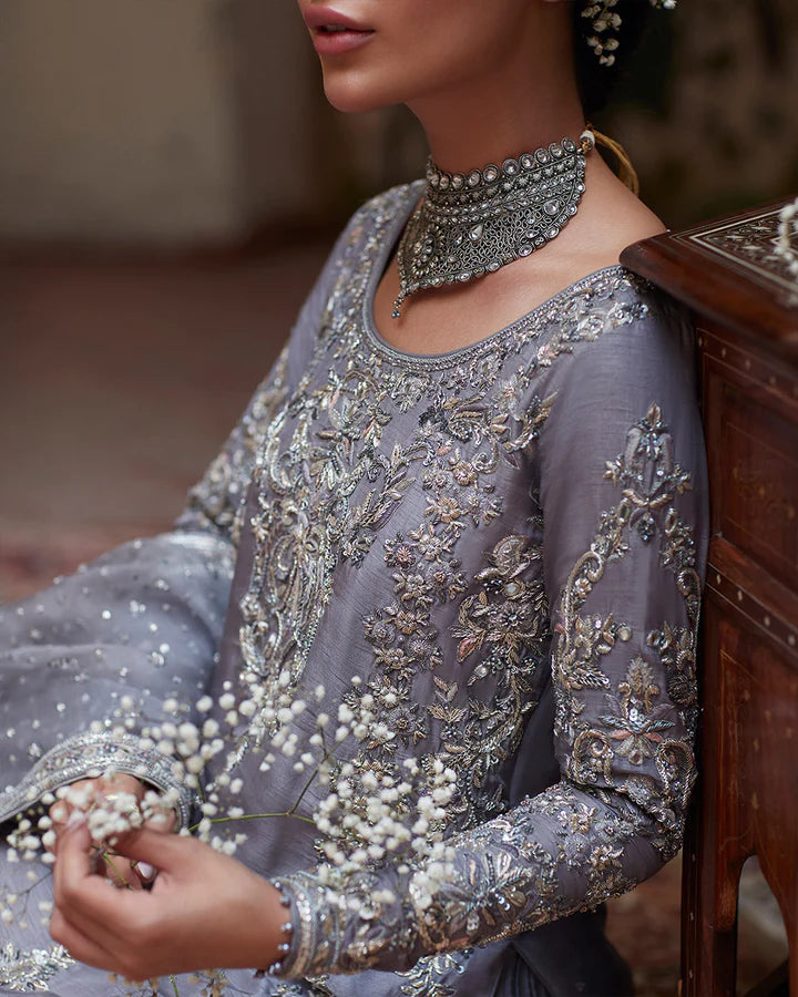 model wearing grey embroidered dress by Faiza Saqlain, Pakistani luxury pret available online in UK