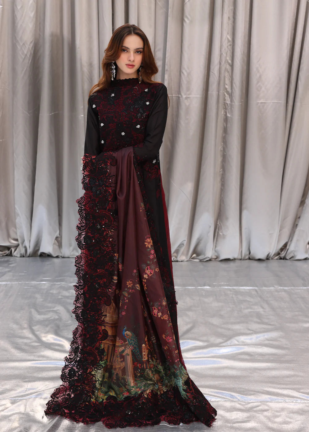 Model wearing black and deep red embroidered long dress with printed maroon dupatta from Musferah Saad Moonlit Glam, Pakistani Luxury pret in UK.
