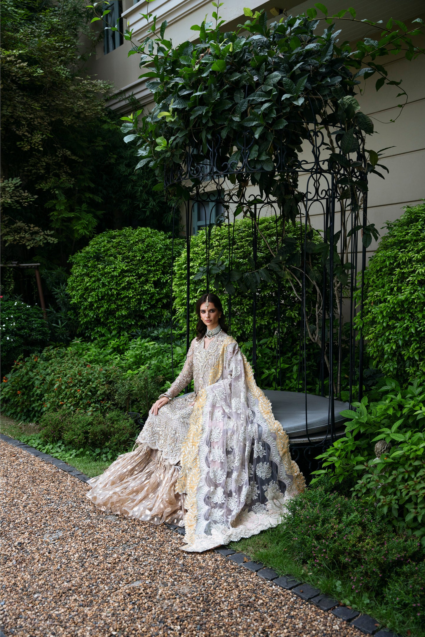 Model wearing PEONY from Mysie by Tahira, a soft beige and gold embellished ensemble, perfect for Pakistani luxury pret in the UK.