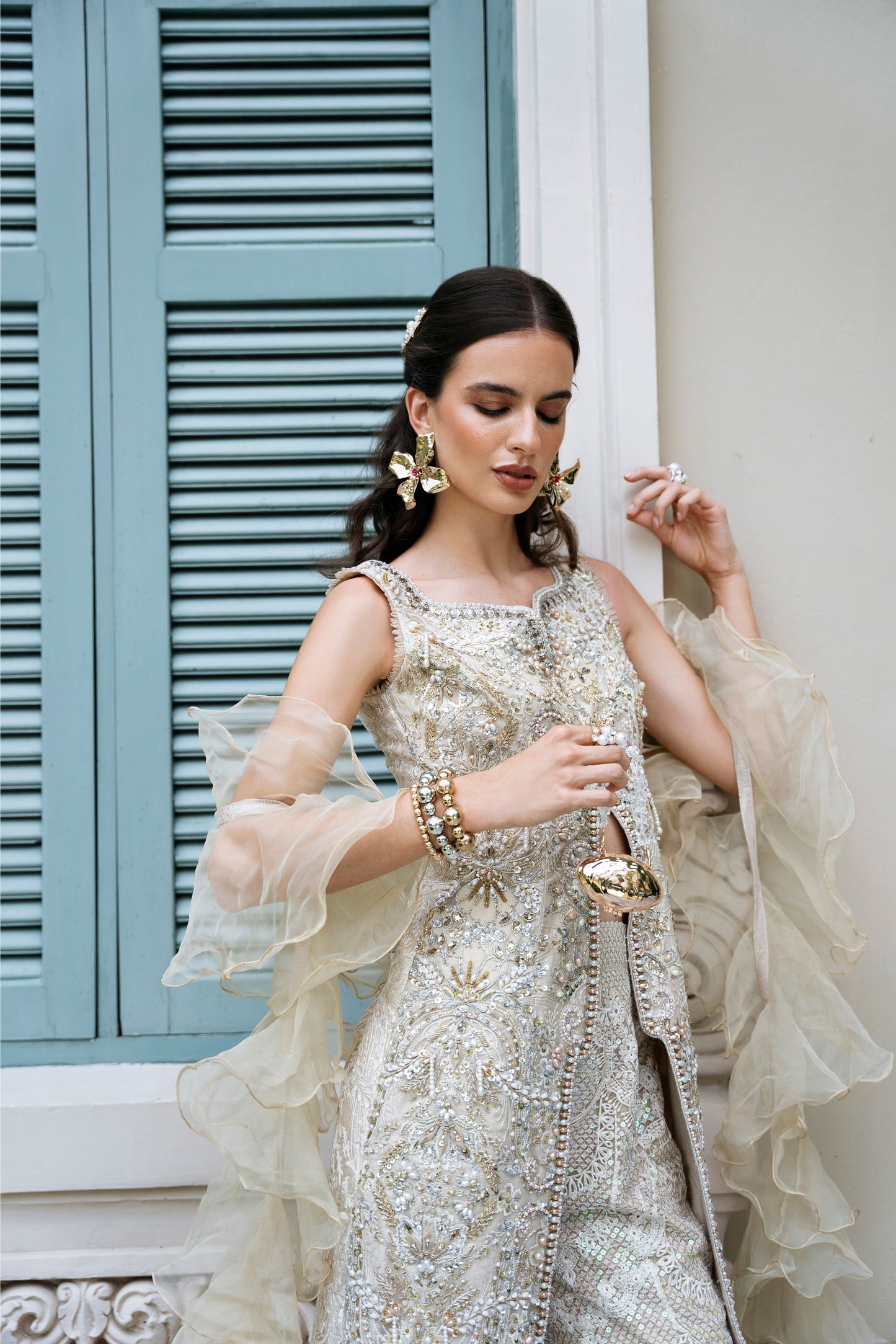 Model wearing Fifi from Mysie by Tahira, a beige embellished outfit with flared pants, perfect for Pakistani luxury pret in the UK.