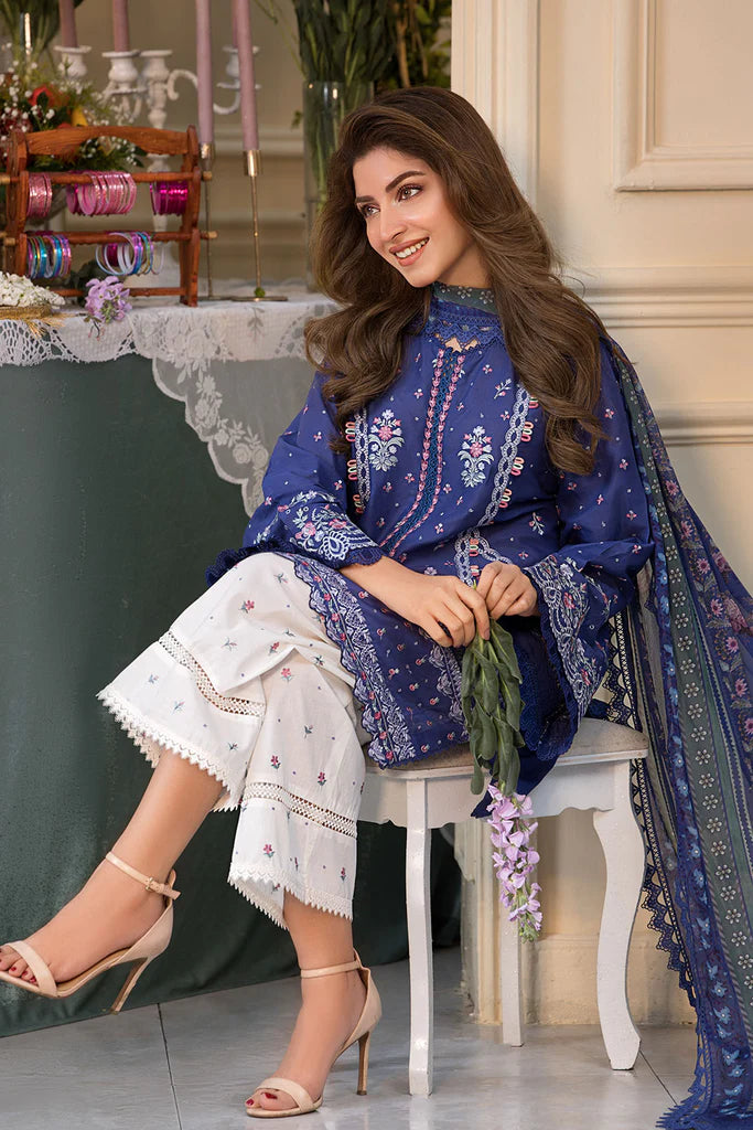 Model wearing royal blue and white printed dress from Sobia Nazir Vital 2025 Design 6B. Pakistani luxury pret and Pakistani clothes online in UK.
