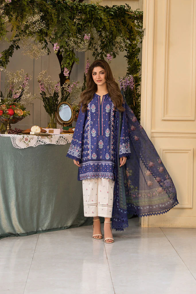 Model wearing royal blue and white printed dress from Sobia Nazir Vital 2025 Design 6B. Pakistani luxury pret and Pakistani clothes online in UK.
