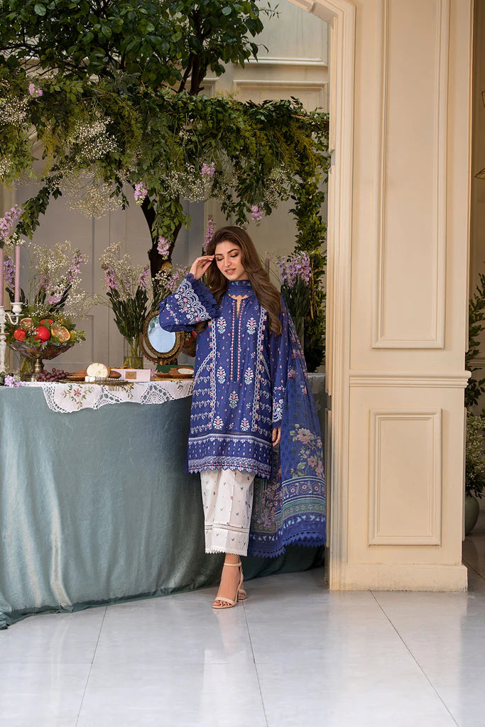 Model wearing royal blue and white printed dress from Sobia Nazir Vital 2025 Design 6B. Pakistani luxury pret and Pakistani clothes online in UK.
