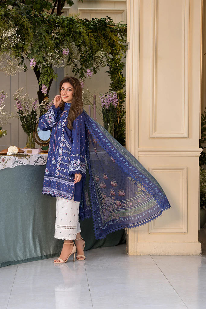 Model wearing royal blue and white printed dress from Sobia Nazir Vital 2025 Design 6B. Pakistani luxury pret and Pakistani clothes online in UK.