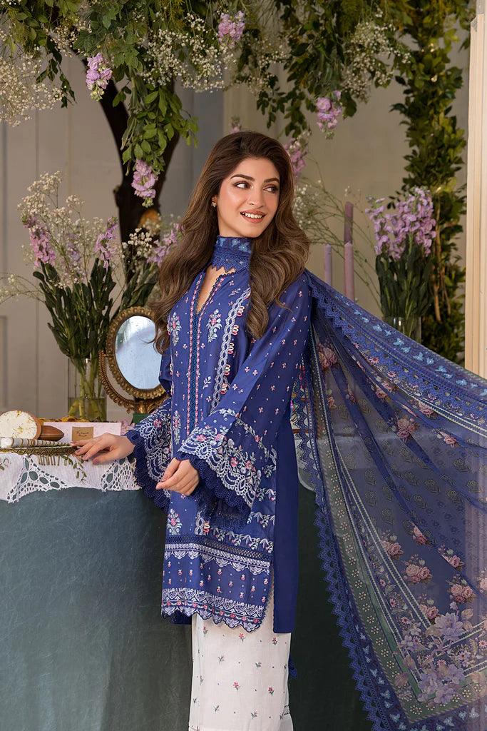 Model wearing royal blue and white printed dress from Sobia Nazir Vital 2025 Design 6B. Pakistani luxury pret and Pakistani clothes online in UK.