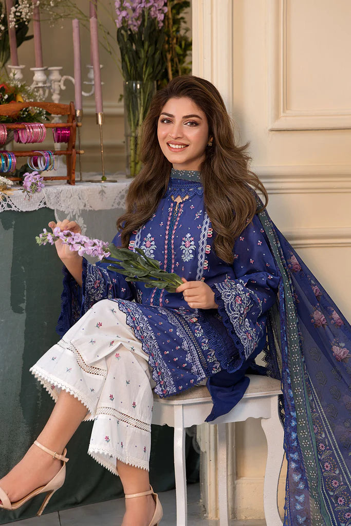 Model wearing royal blue and white printed dress from Sobia Nazir Vital 2025 Design 6B. Pakistani luxury pret and Pakistani clothes online in UK.