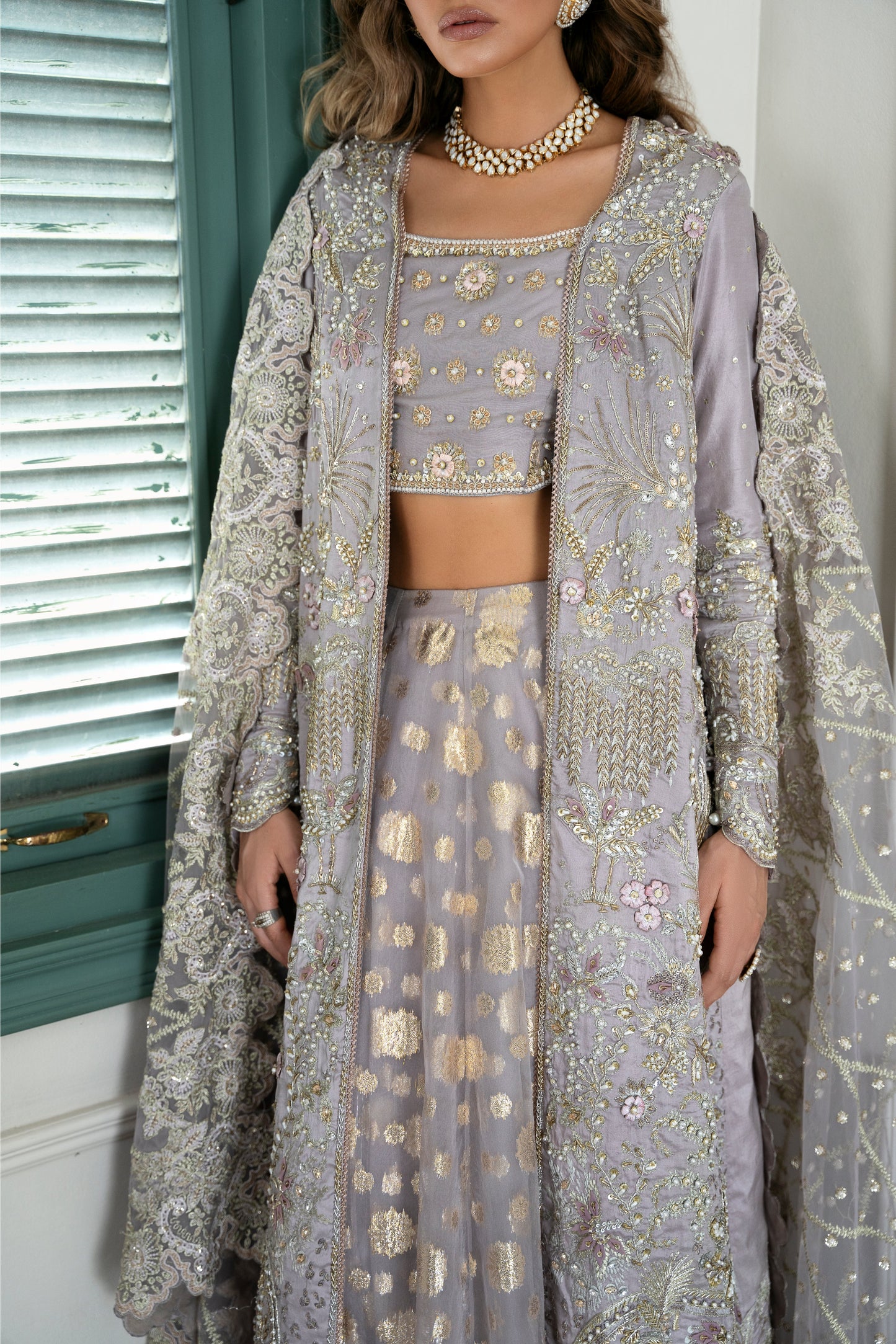 Model wearing Lotus from Mysie by Tahira, a luxurious grey embellished lehenga choli perfect for Pakistani luxury pret in the UK.