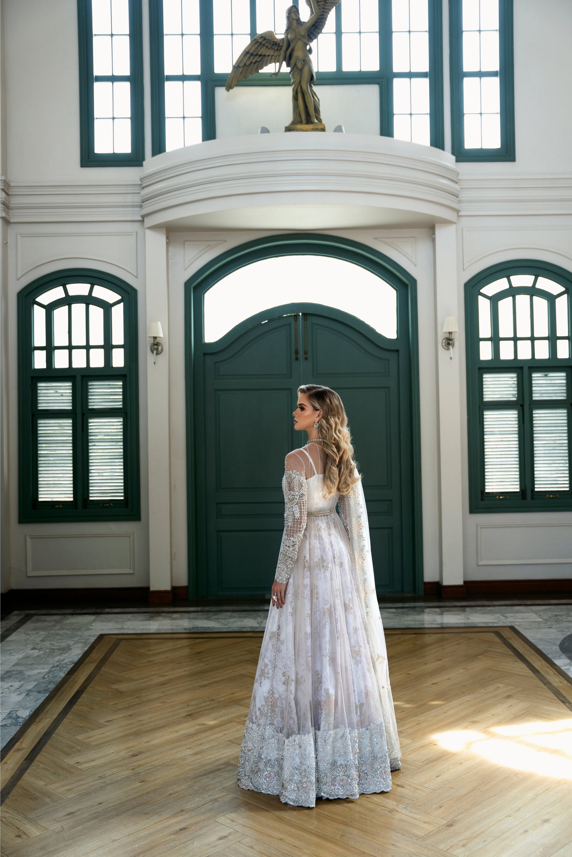 Model wearing Snowdrop from Mysie by Tahira, a stunning white and silver luxury pret outfit, perfect for Pakistani clothes in the UK.