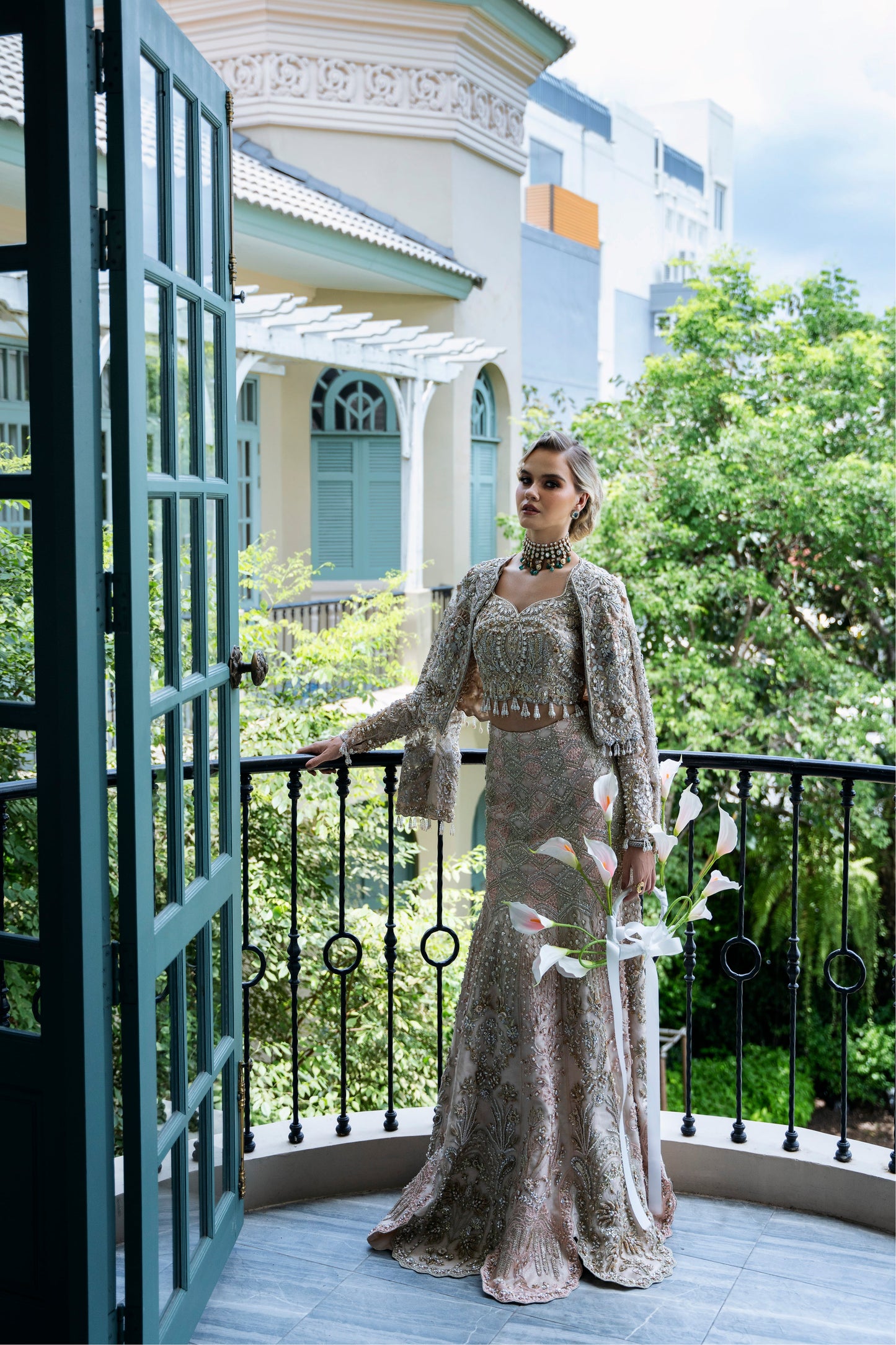Model wearing soft pastel pink and gold embellished lehenga MALISA from Mysie by Tahira, Pakistani luxury pret available online in UK.