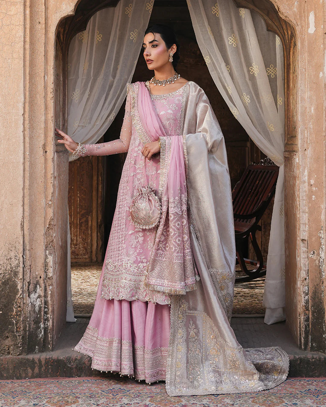 Model wearing blush pink Faiza Saqlain Vemita outfit with embellished detailing and dupatta, perfect for Pakistani luxury pret in the UK.