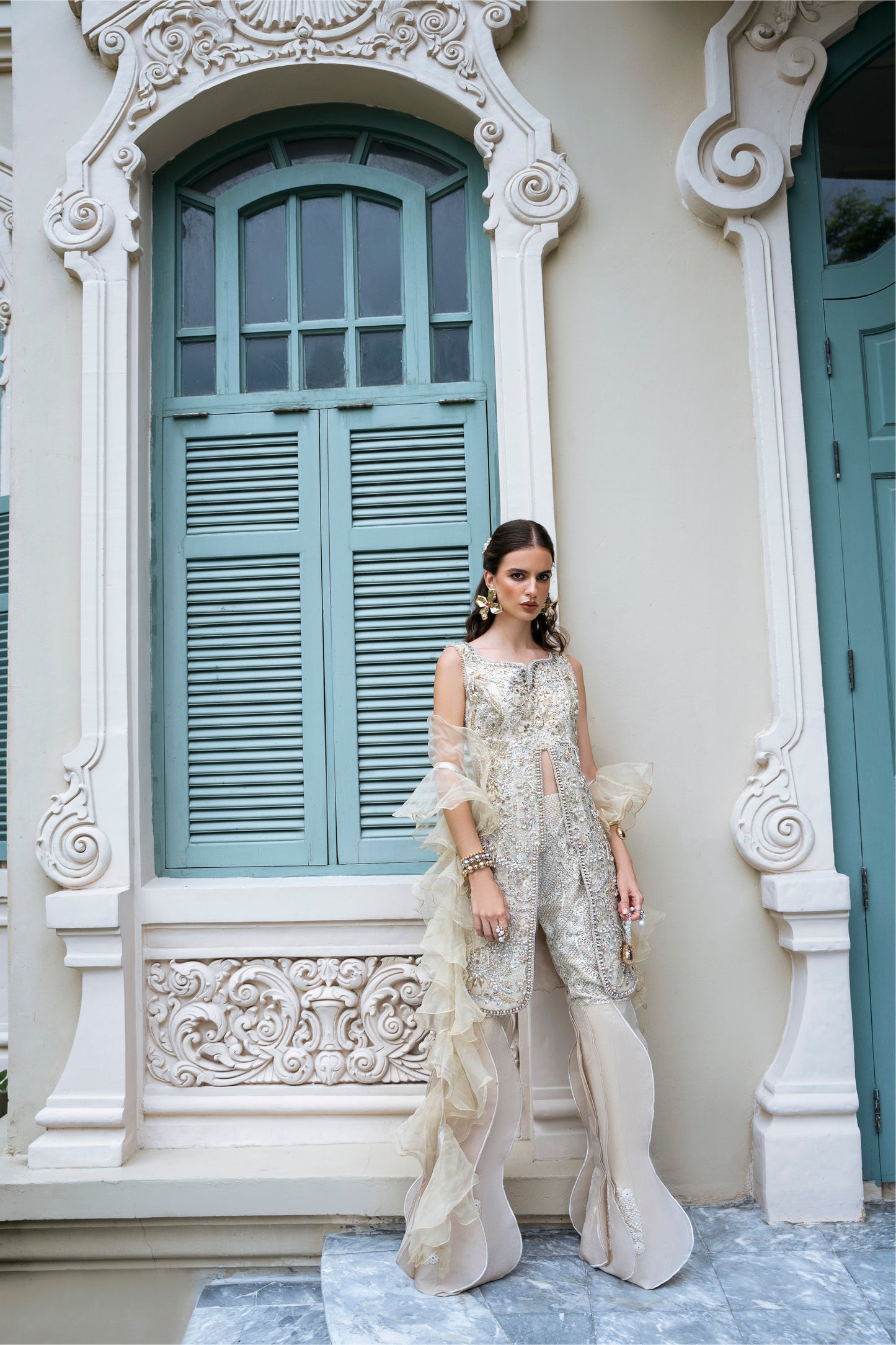 Model wearing Fifi from Mysie by Tahira, a beige embellished outfit with flared pants, perfect for Pakistani luxury pret in the UK.
