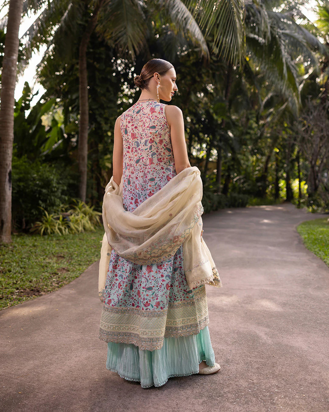 Model wearing multicolored Danica dress with mint trousers from Faiza Saqlain Zinnia collection, Pakistani Luxury pret, Pakistani clothes online in UK.