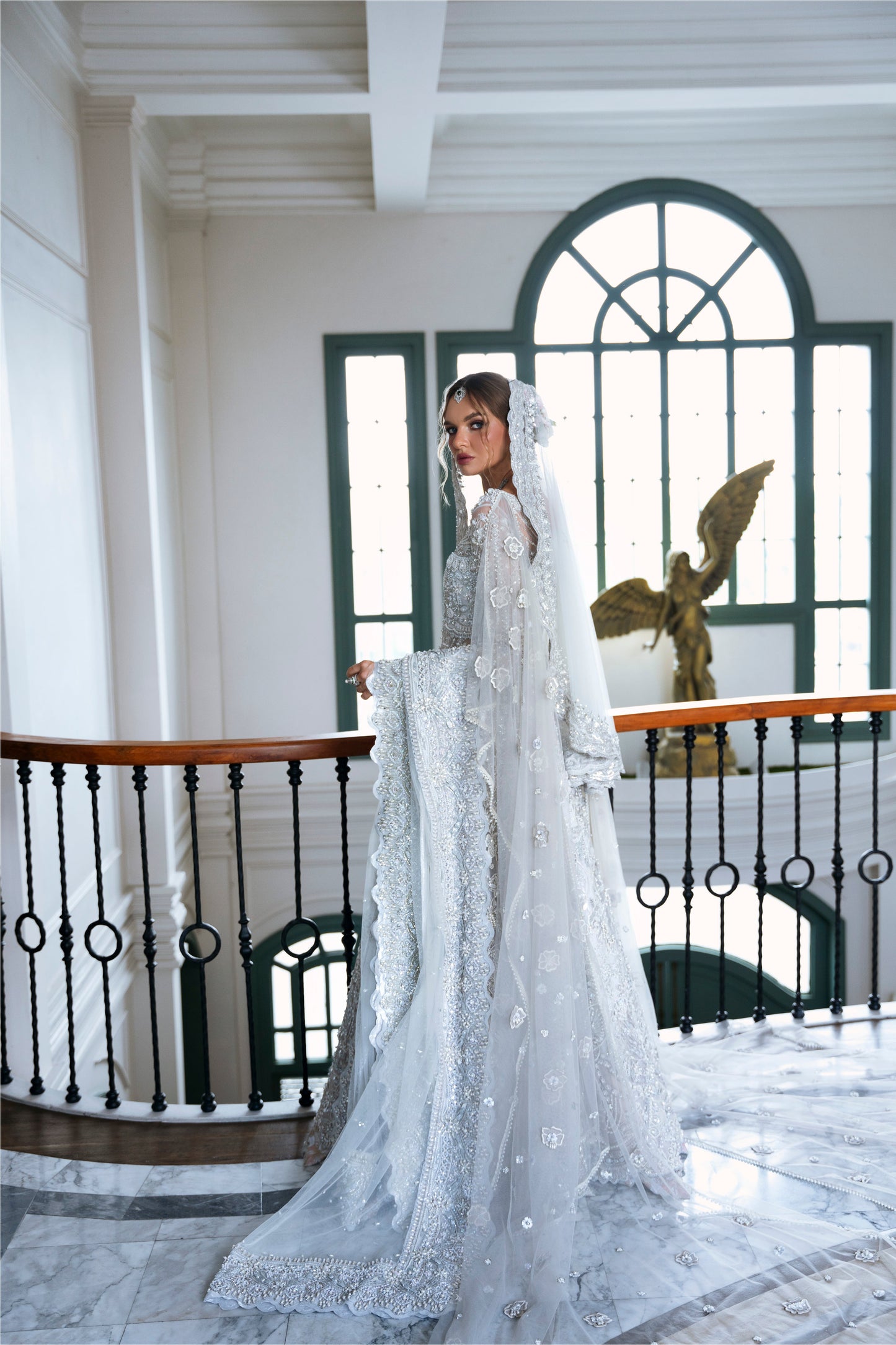 Model wearing silver embellished gown DAHLIA from Mysie by Tahira, Pakistani luxury pret perfect for weddings, now online in UK.