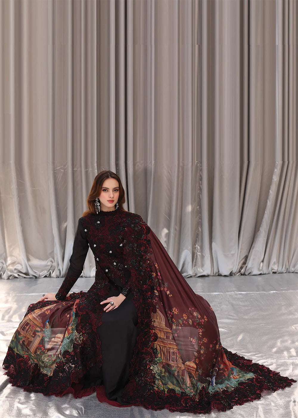 Model wearing black and deep red embroidered long dress with printed maroon dupatta from Musferah Saad Moonlit Glam, Pakistani Luxury pret in UK.