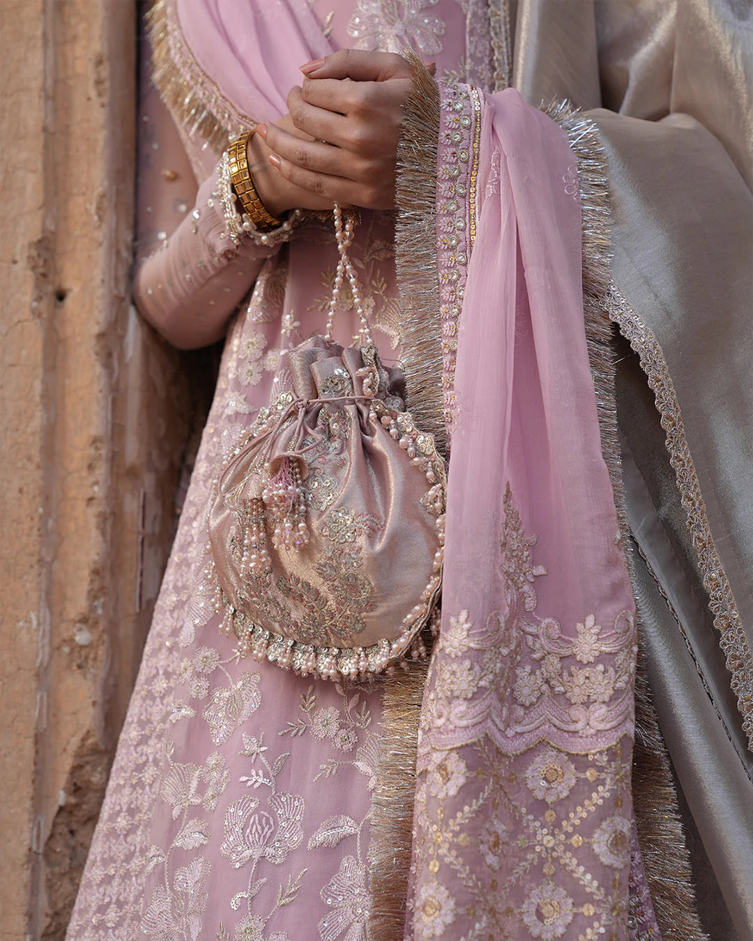 Model wearing blush pink Faiza Saqlain Vemita outfit with embellished detailing and dupatta, perfect for Pakistani luxury pret in the UK.