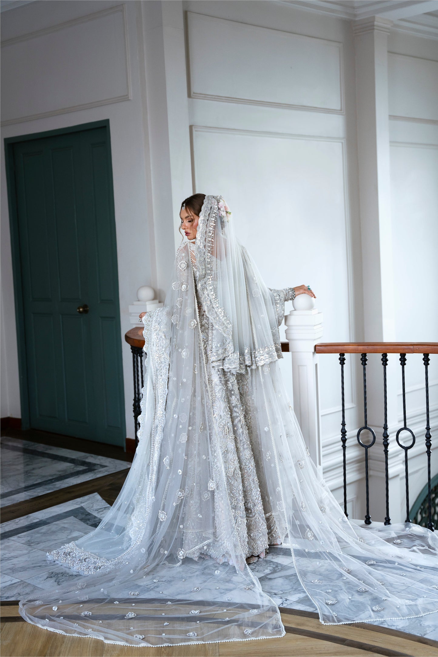 Model wearing silver embellished gown DAHLIA from Mysie by Tahira, Pakistani luxury pret perfect for weddings, now online in UK.