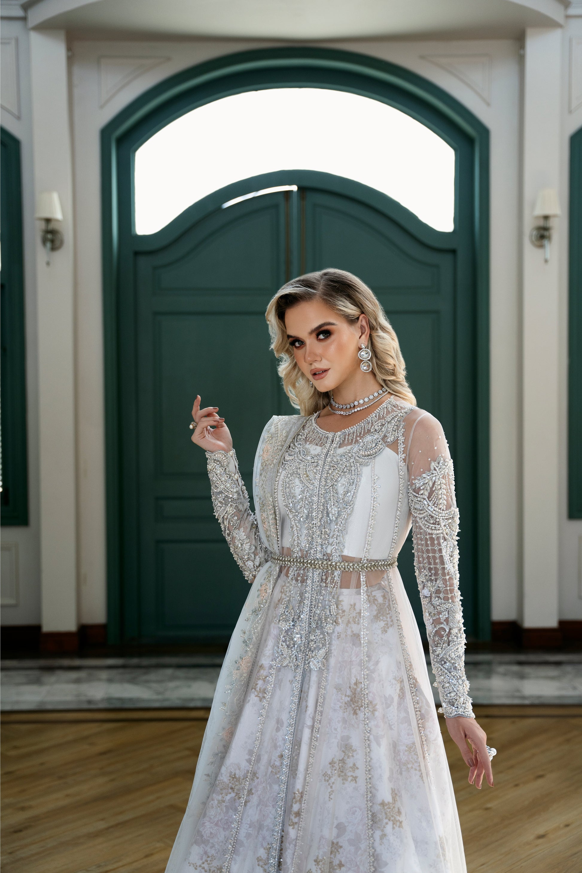 Model wearing Snowdrop from Mysie by Tahira, a stunning white and silver luxury pret outfit, perfect for Pakistani clothes in the UK.