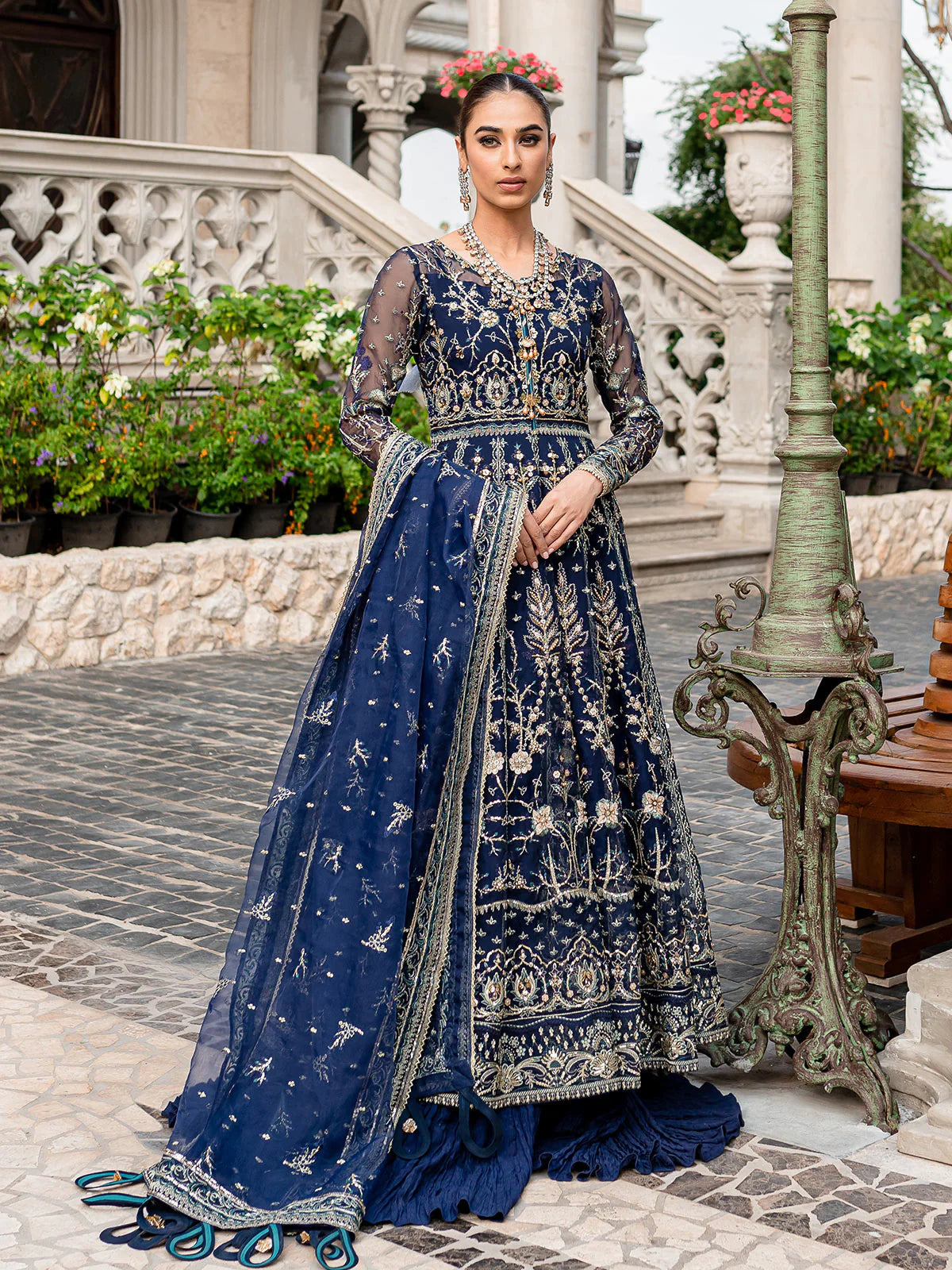 Model wearing navy blue Miray GL-LP-V1-08 from Gulaal, a heavily embroidered Pakistani luxury pret—shop Gulaal clothes online in UK.