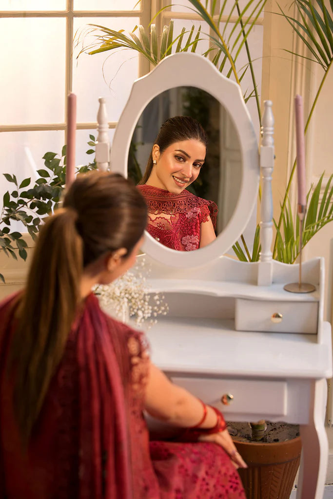 Model wearing Sobia Nazir Vital 2025 Design 8B in red with laser-cut detailing and embroidered dupatta. Shop Pakistani clothes online in UK and explore premium Pakistani luxury pret.