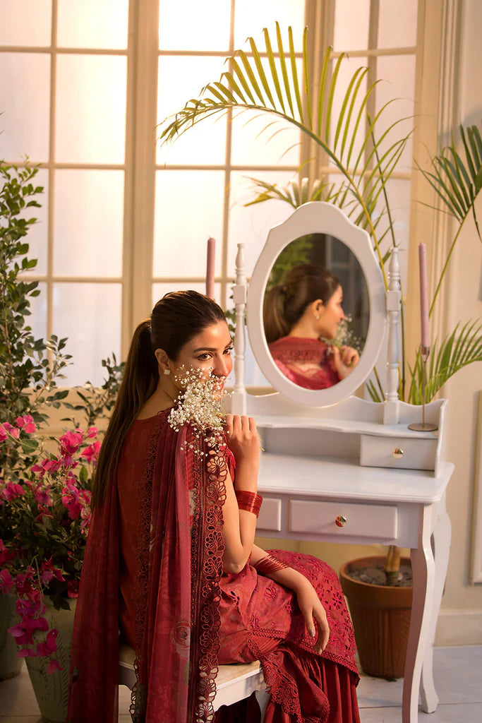 Model wearing Sobia Nazir Vital 2025 Design 8B in red with laser-cut detailing and embroidered dupatta. Shop Pakistani clothes online in UK and explore premium Pakistani luxury pret.