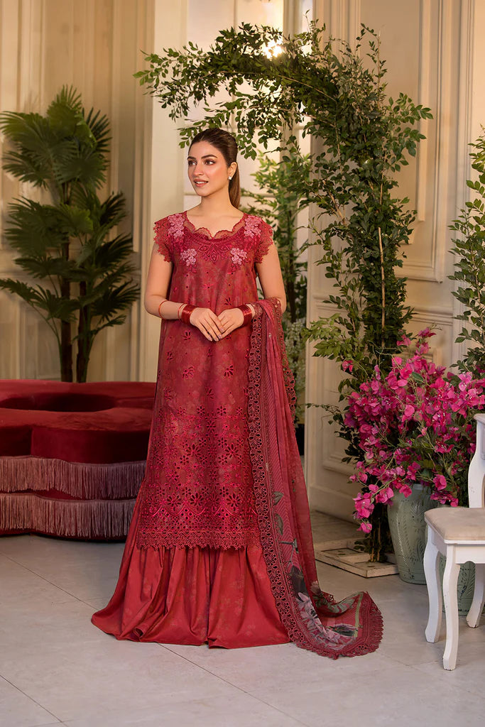 Model wearing Sobia Nazir Vital 2025 Design 8B in red with laser-cut detailing and embroidered dupatta. Shop Pakistani clothes online in UK and explore premium Pakistani luxury pret.