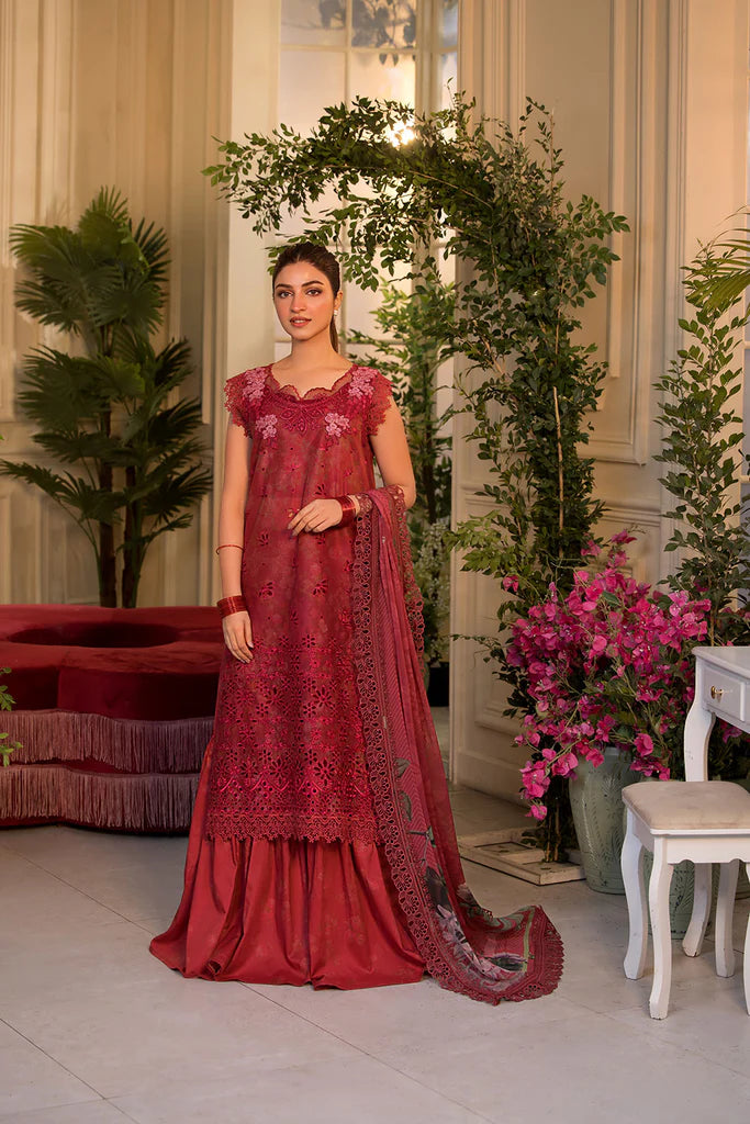 Model wearing Sobia Nazir Vital 2025 Design 8B in red with laser-cut detailing and embroidered dupatta. Shop Pakistani clothes online in UK and explore premium Pakistani luxury pret.
